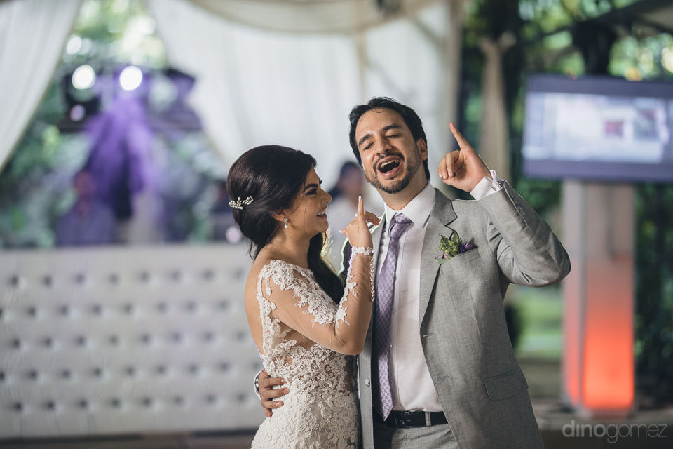 newlyweds pose in fun photo for hacienda wedding photographer di